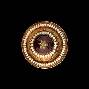 1066. A garnet, white enamel and rose-cut diamond brooch/pendant.