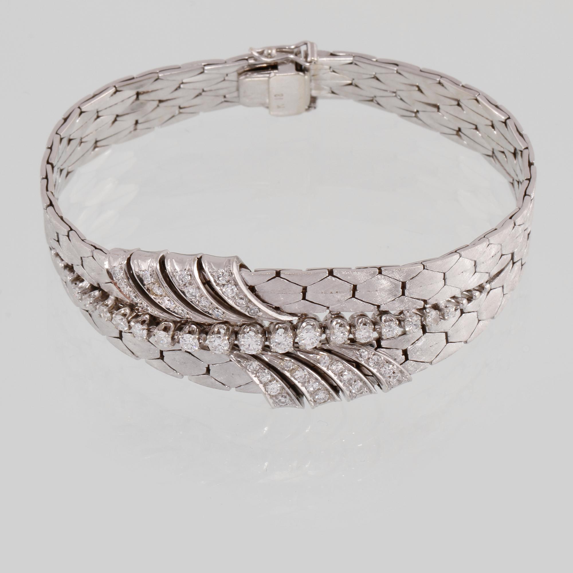 ARMBAND, 18K vitguld med briljant och åttkantslipade diamanter ca 1.30 ct. Vikt 54,5 gram.