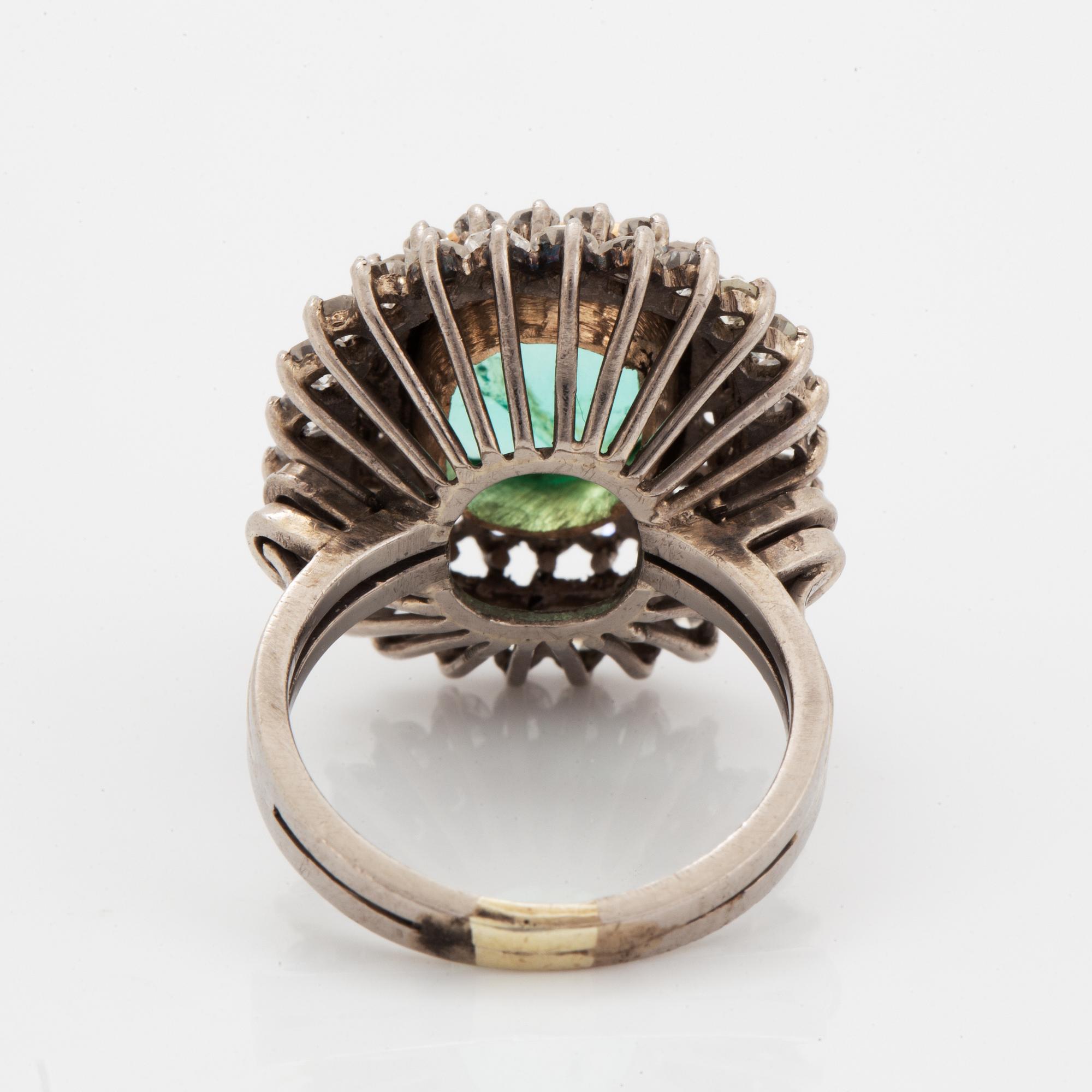 Emerald-cut emerald and eight-cut diamond ring.