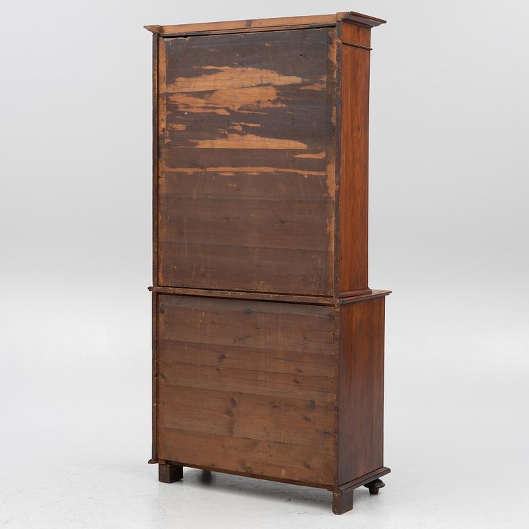 A two part mahogany cabinet, around 1900.