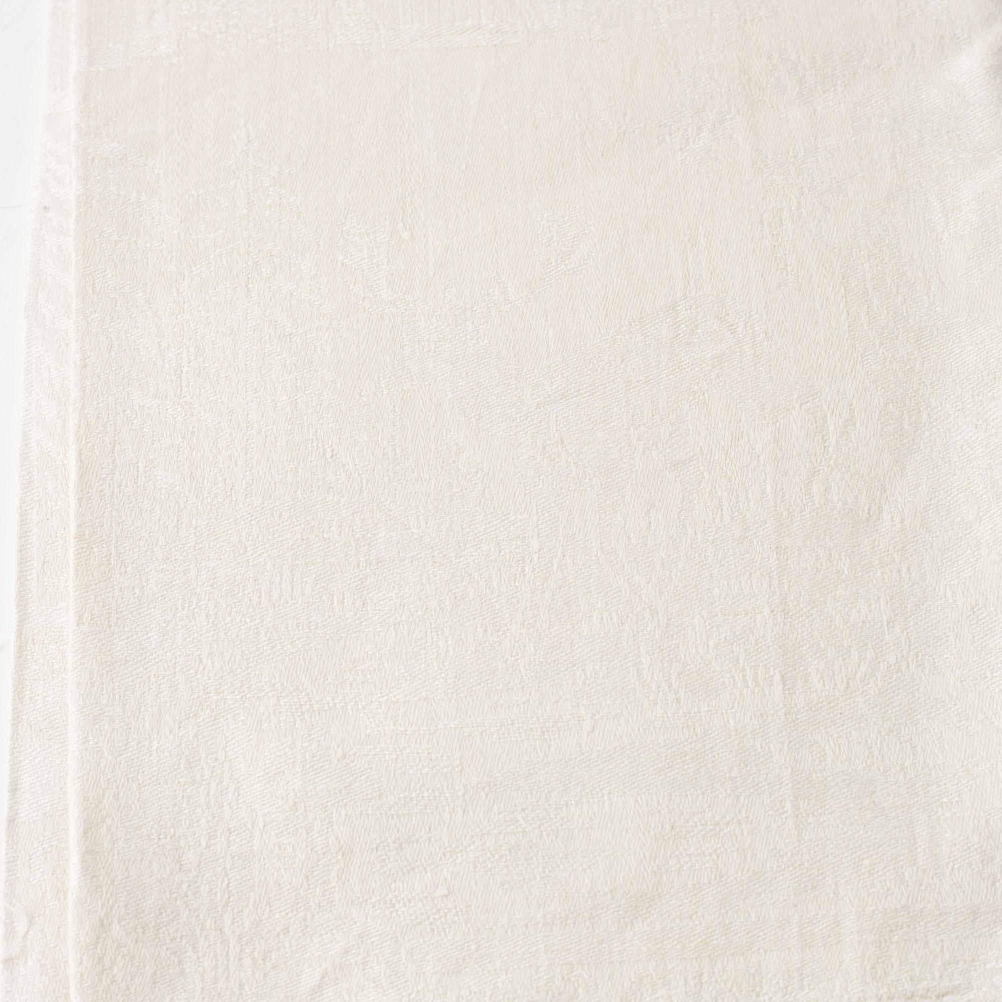 A linen tablecloth and five napkins.