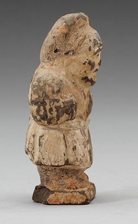 A small potted figure of a man, Han dynasty (206 BC - 220 AD).