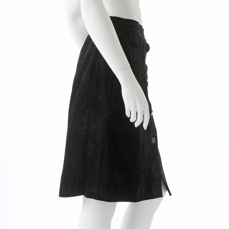 YVES SAINT LAURENT, a black suede skirt.