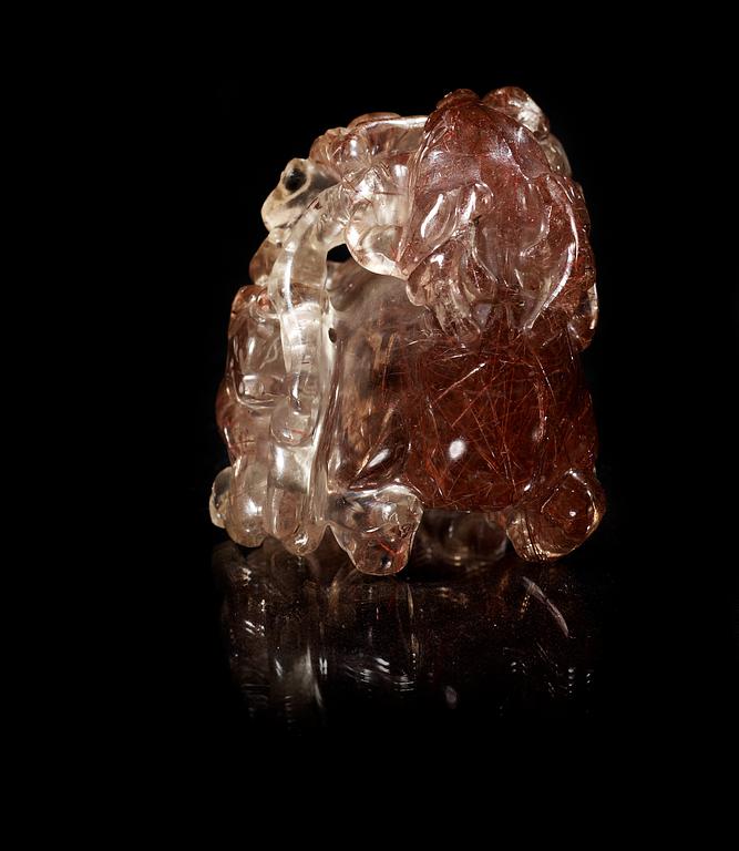 A carved quartz figure of a reclining deer with a dog and som fungus, China, early 20th Century.