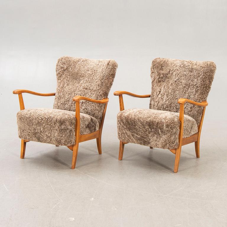 A pair of Swedish sheep skin 1940s armchairs.