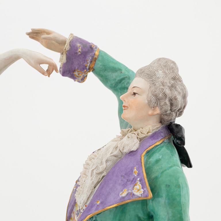 A rococo style porcelain figurine from the early 20th century.