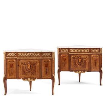 A pair of Gustavian marquetry, ormolu-mounted, and marble encoignures by G. Iwersson (master in Stockholm 1778-1813).