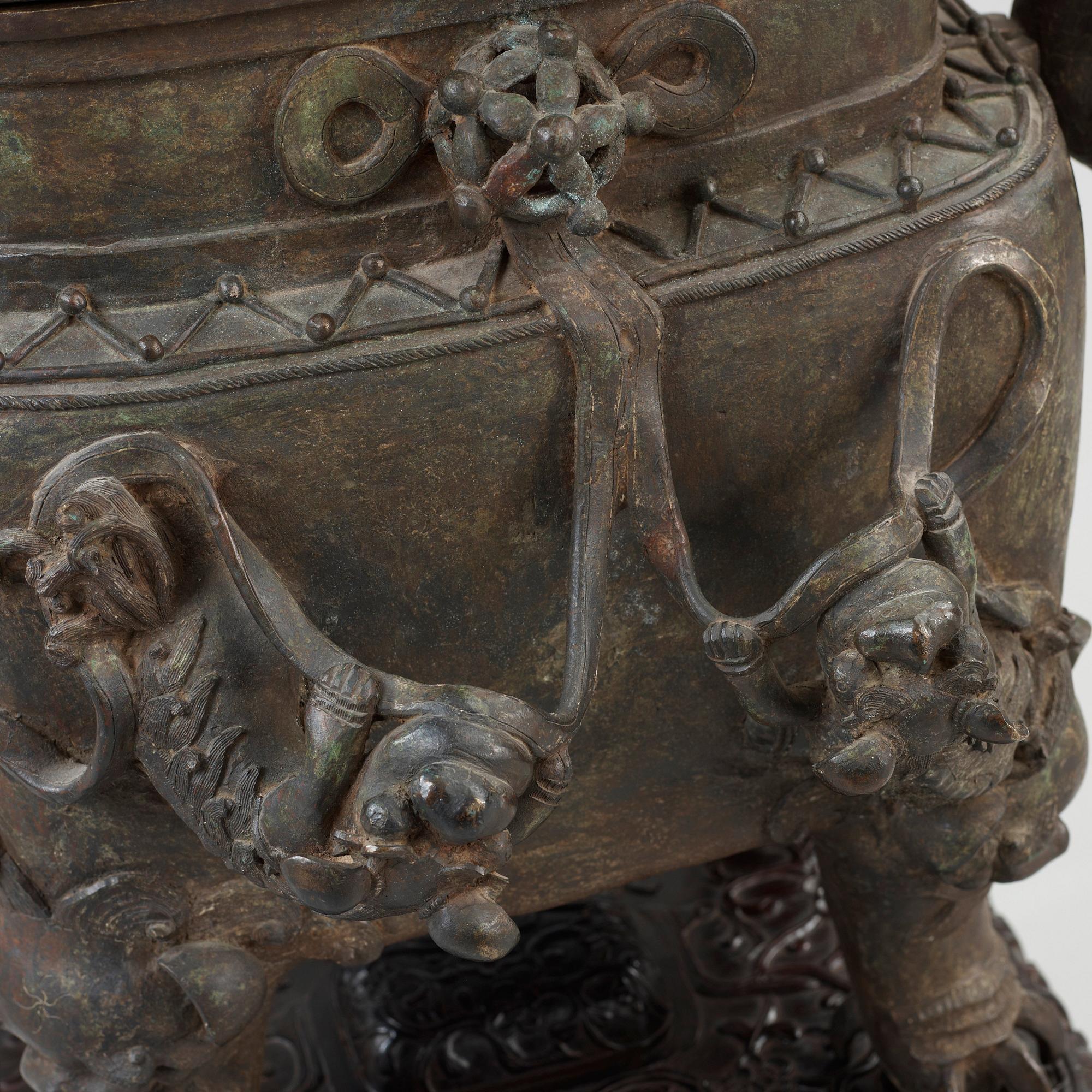 A bronz censer with Zitan stand, Qing dynasty, presumably 19th century. With character mark.