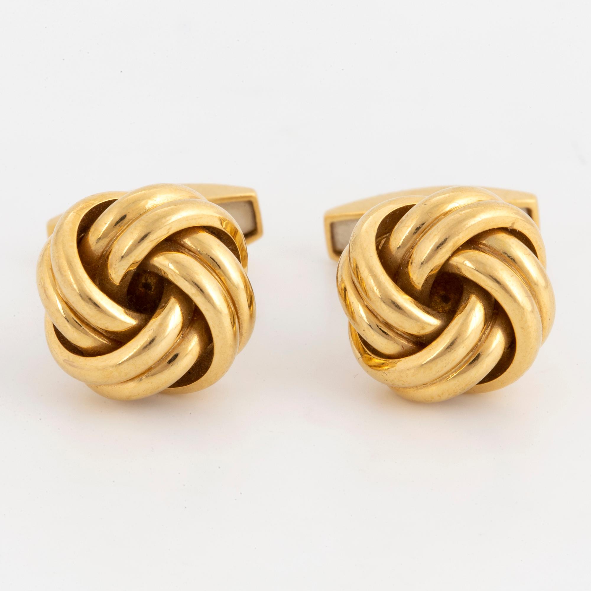 18K gold knot-shaped cufflinks.