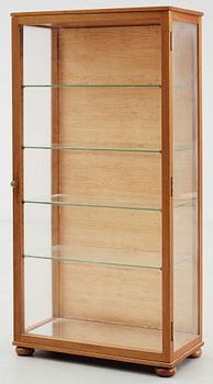 A Josef Frank mahogany and glass cabinet by Svenskt Tenn, model 649.