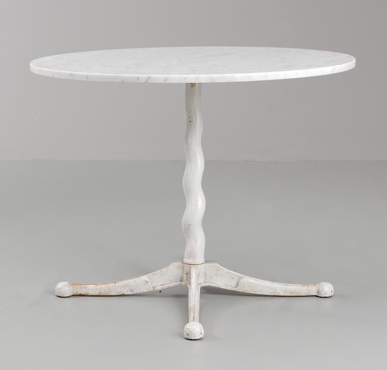 A cast iron and marble top garden table, Firma Svenskt Tenn, 1930's-40's.