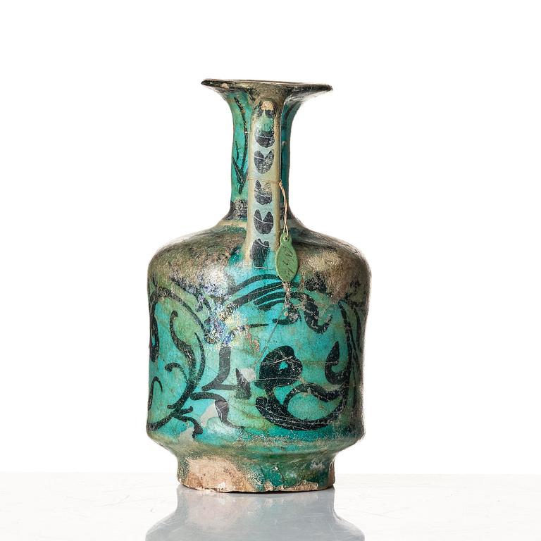 A Kashan turquoise blue-glazed ewer, central Persia (Iran), 11th to 12th century.