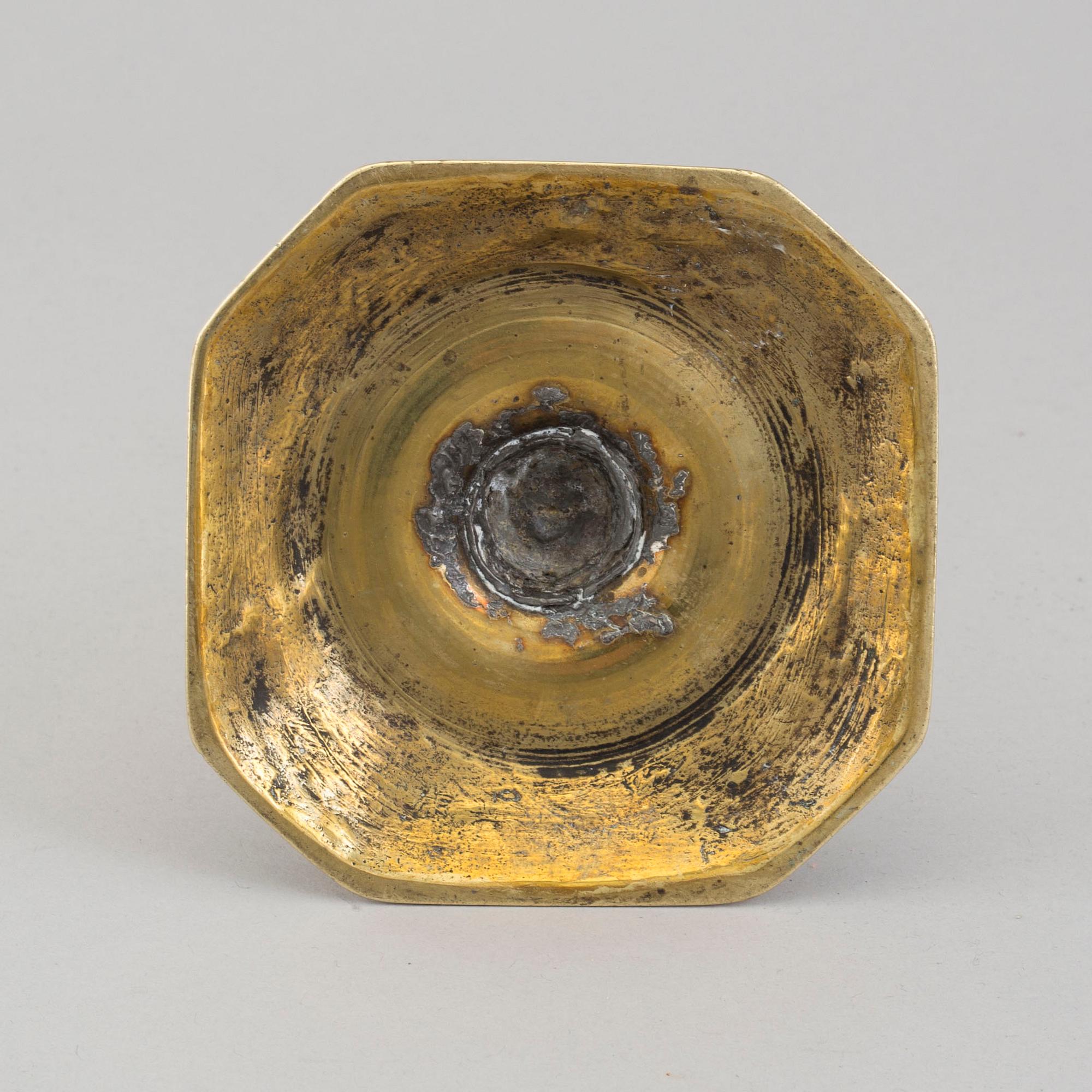 An 18th century bronze candlestick.