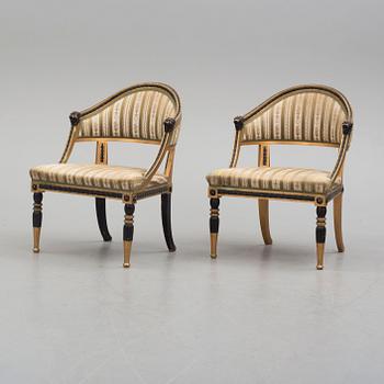 A pair of Gustavian style armchairs.