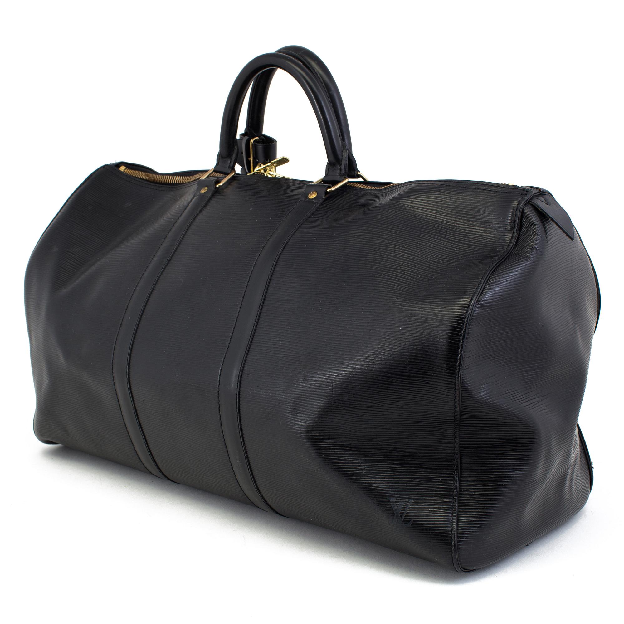 A Louis Vuitton weekend bag  "Keepall 50 Epi Black".