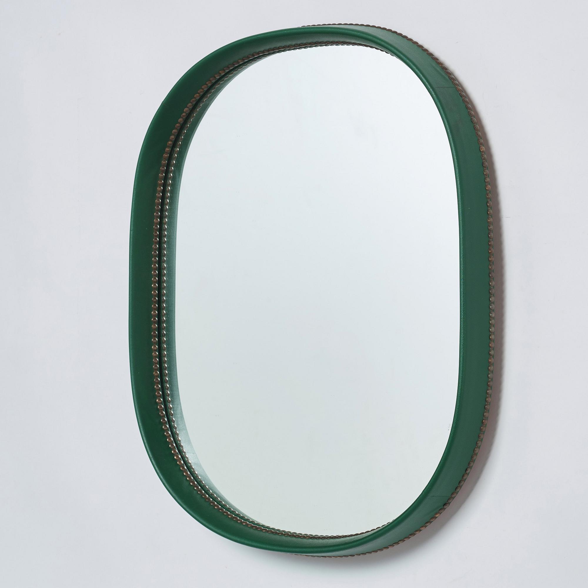 Otto Schulz, an artifical leather framed wall mirror, Boet, Gothenburg, Sweden 1940-50's.