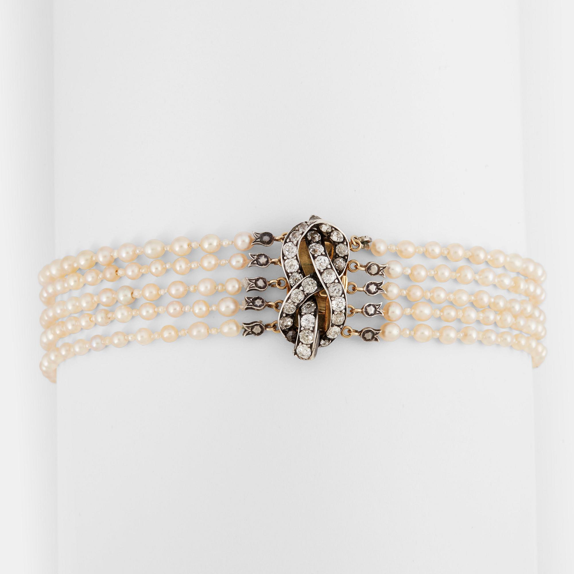 A five strand natural saltwater pearl necklace.