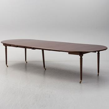 A mid 20th century mahogany veneered dining table by AB Harald Westerberg, Stockholm.