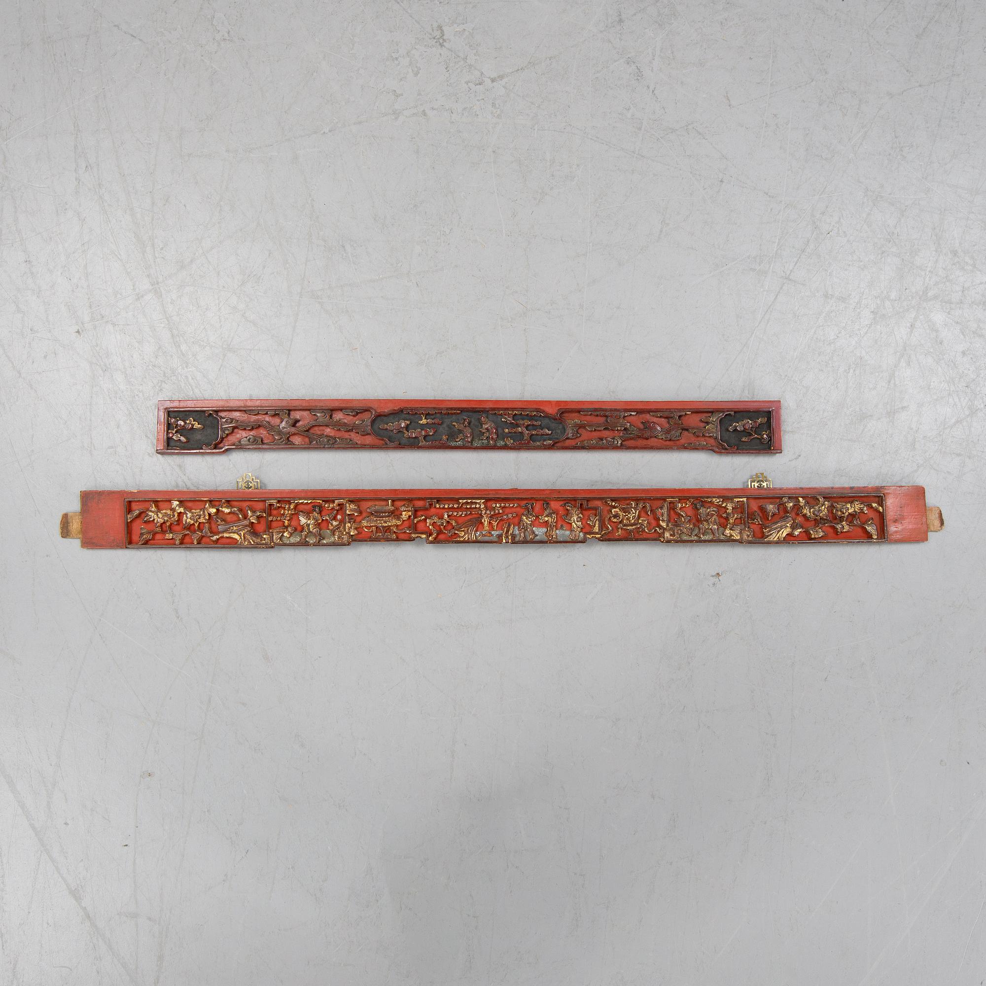 Two Chinese red lacquered wooden panels, 20th century.
