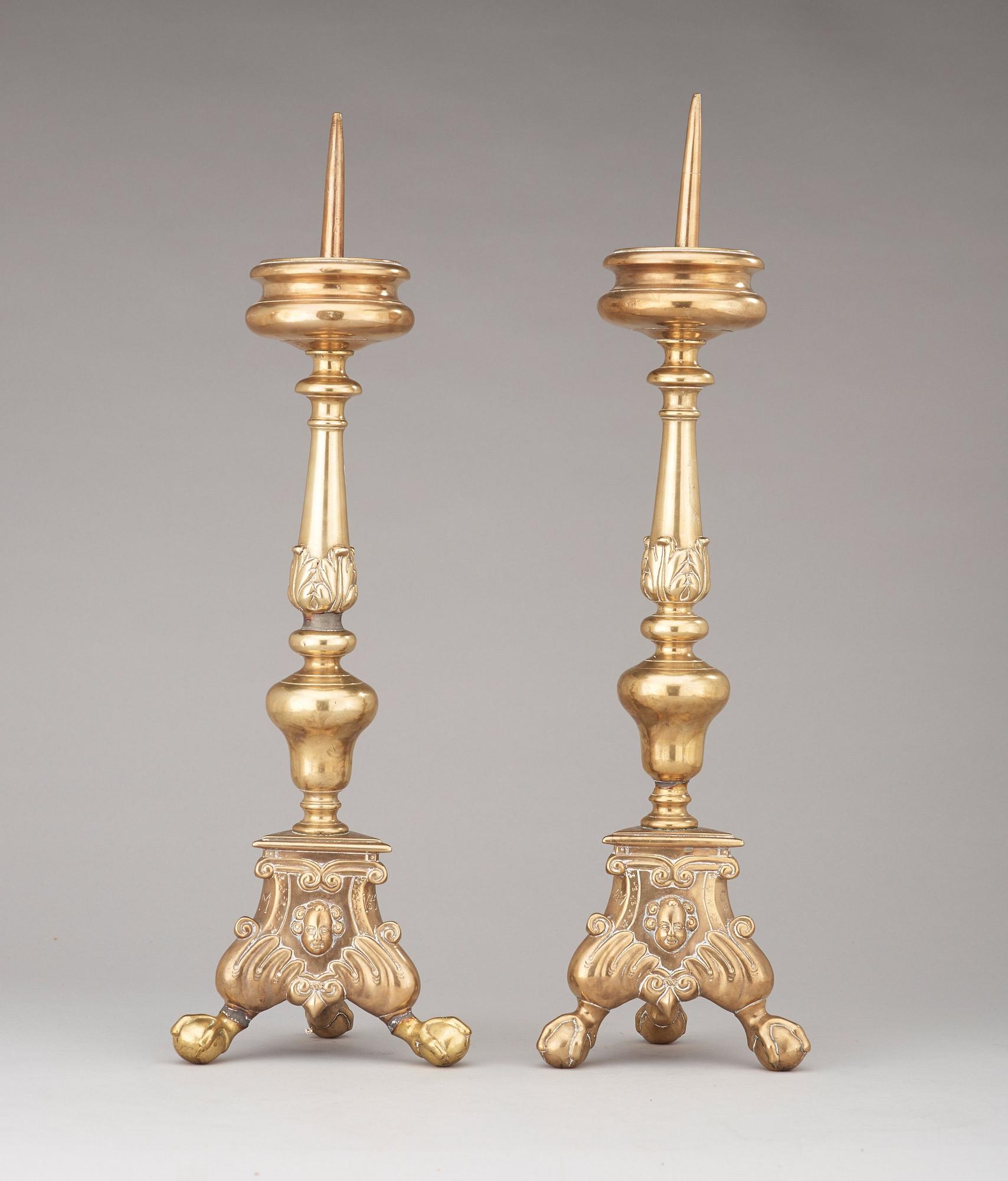 A pair of probably Flemish 17th century brass pricket candlesticks.
