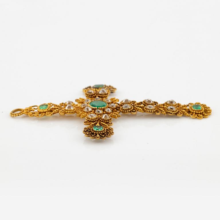A cross in 14K gold set with faceted emeralds and old-cut diamonds, likely 18th century.