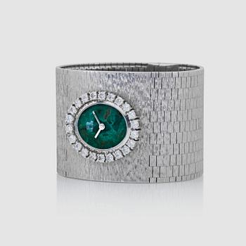 1079. A Milner ladie's wristwatch. Dial in chrysocolla and bezel set with brilliant-cut diamonds.