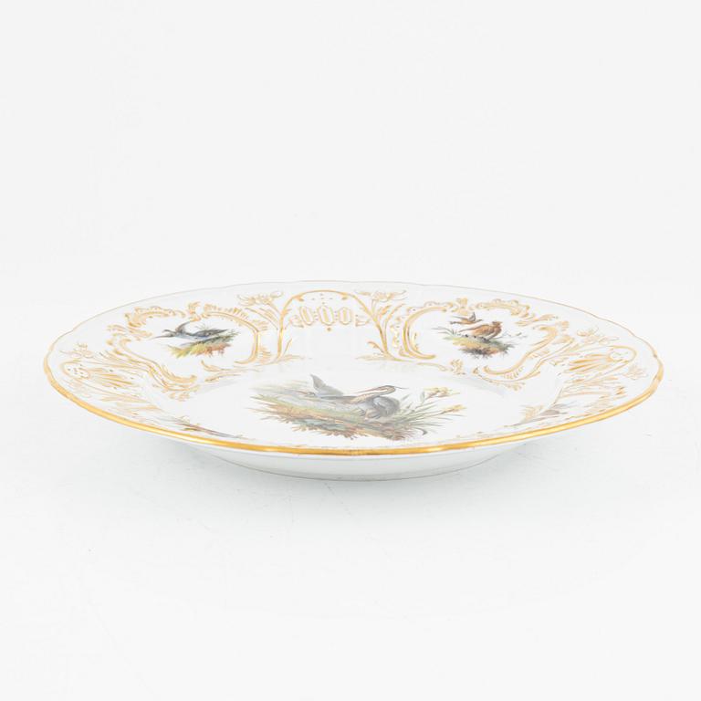 A set of five Meissen porcelain games plates, late 19th to early 20th century.