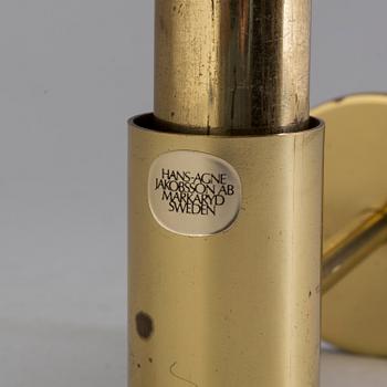 HANS AGNE JAKOBSSON, VÄGGLYCKTA, mässing, Markaryd, 1900-talets andra hälft.