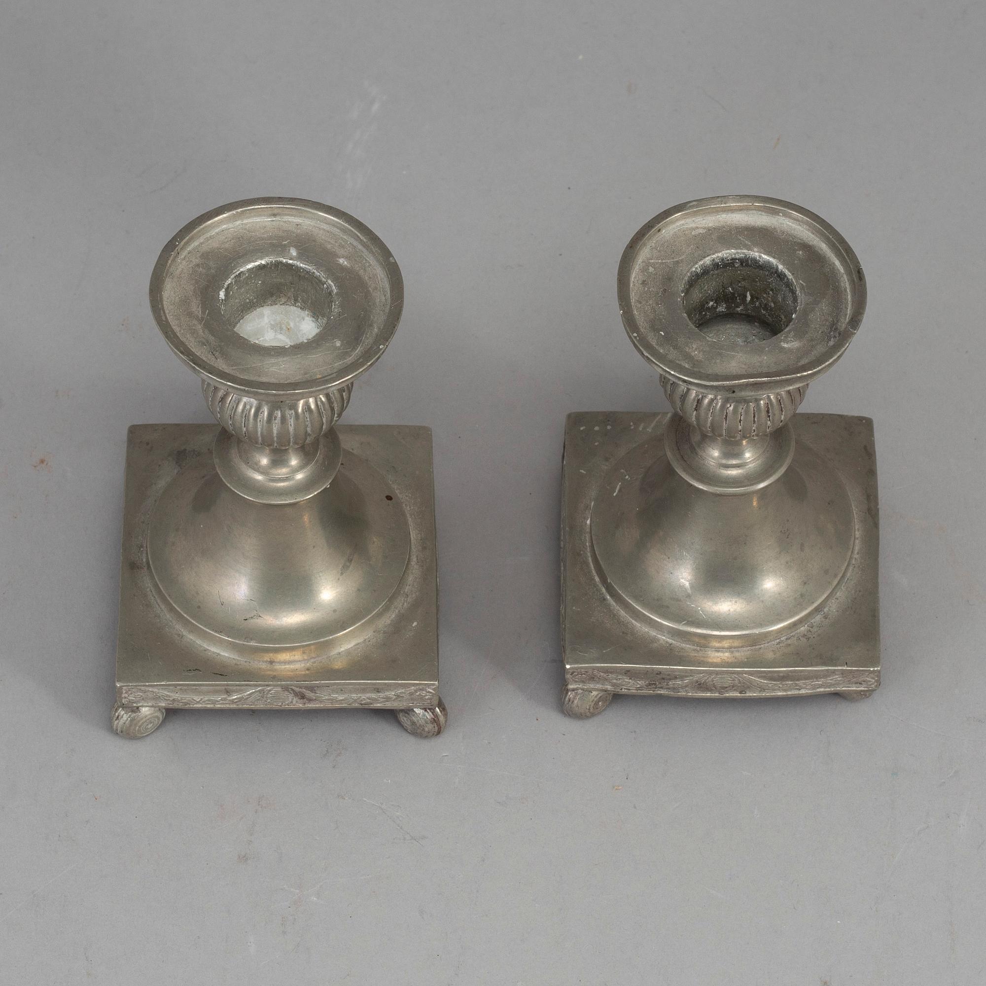 A pair of Swedish late gustavian pewter candlesticks, early 19th century.