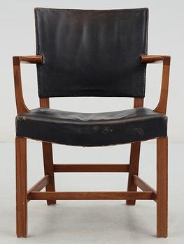 A Kaare Klint mahogany and black leather armchair by Rud Rasmussen snedkerier, Denmark.