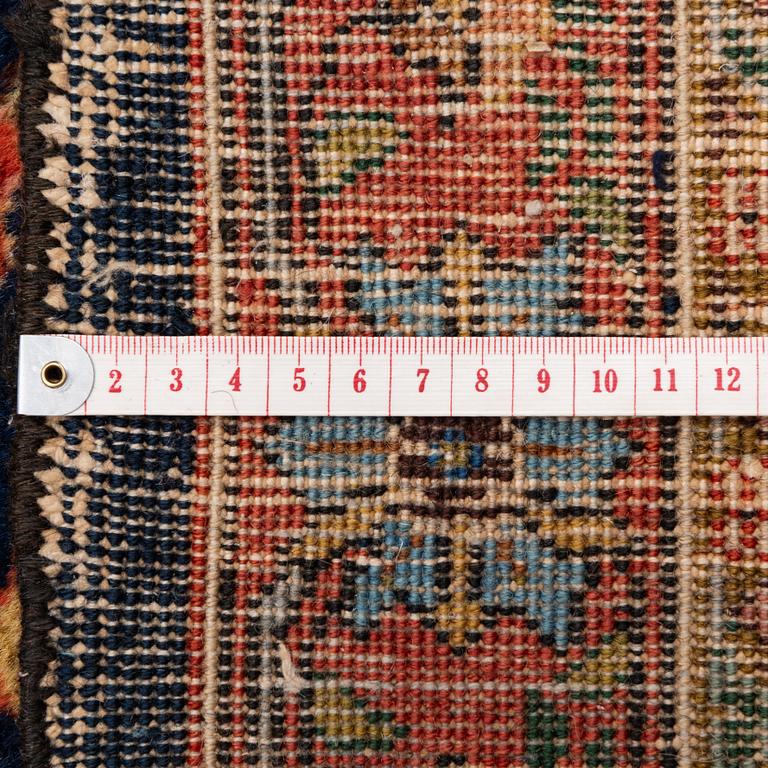 A semi-antique Tabriz carpet, c. 395 x 295 cm.