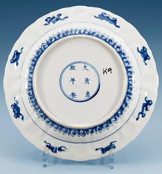 A set of four blue and white dishes, Qing dynasty with Kangxi's six character mark and period. (4).