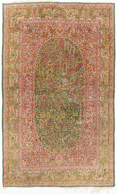 A semi-antique Kirman Carpet, circa 304 x 186 cm.