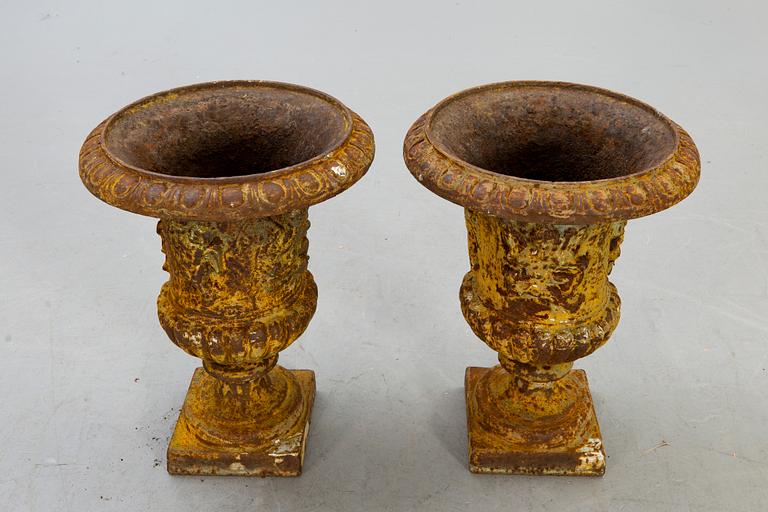 A pair of cast iron garden urns fist half of the 20th century.