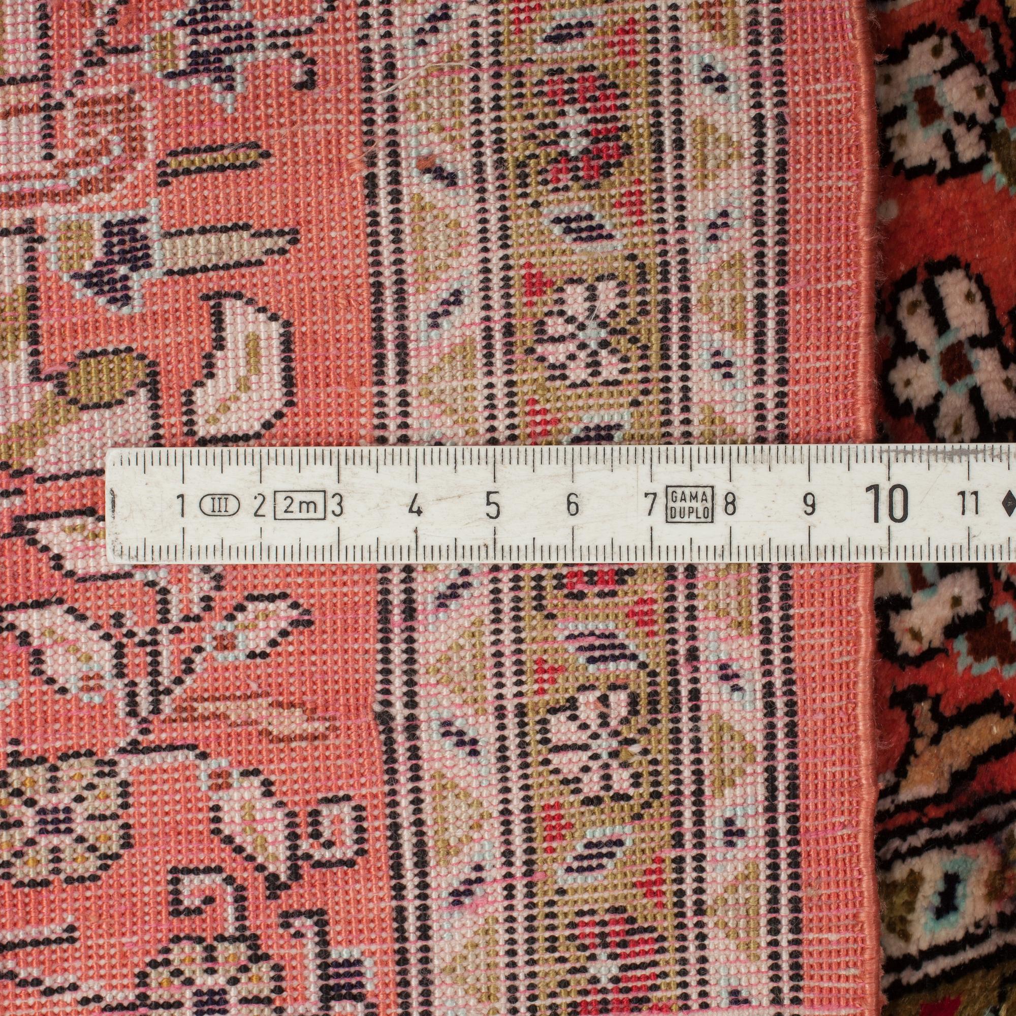 A RUG, AN OLD SILK QUM, ca 75 x 65 cm.