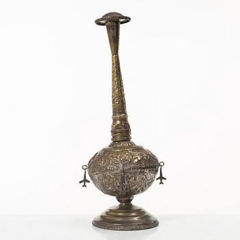 An 20th century british Raj repoussé metal rosewater sprinkler.