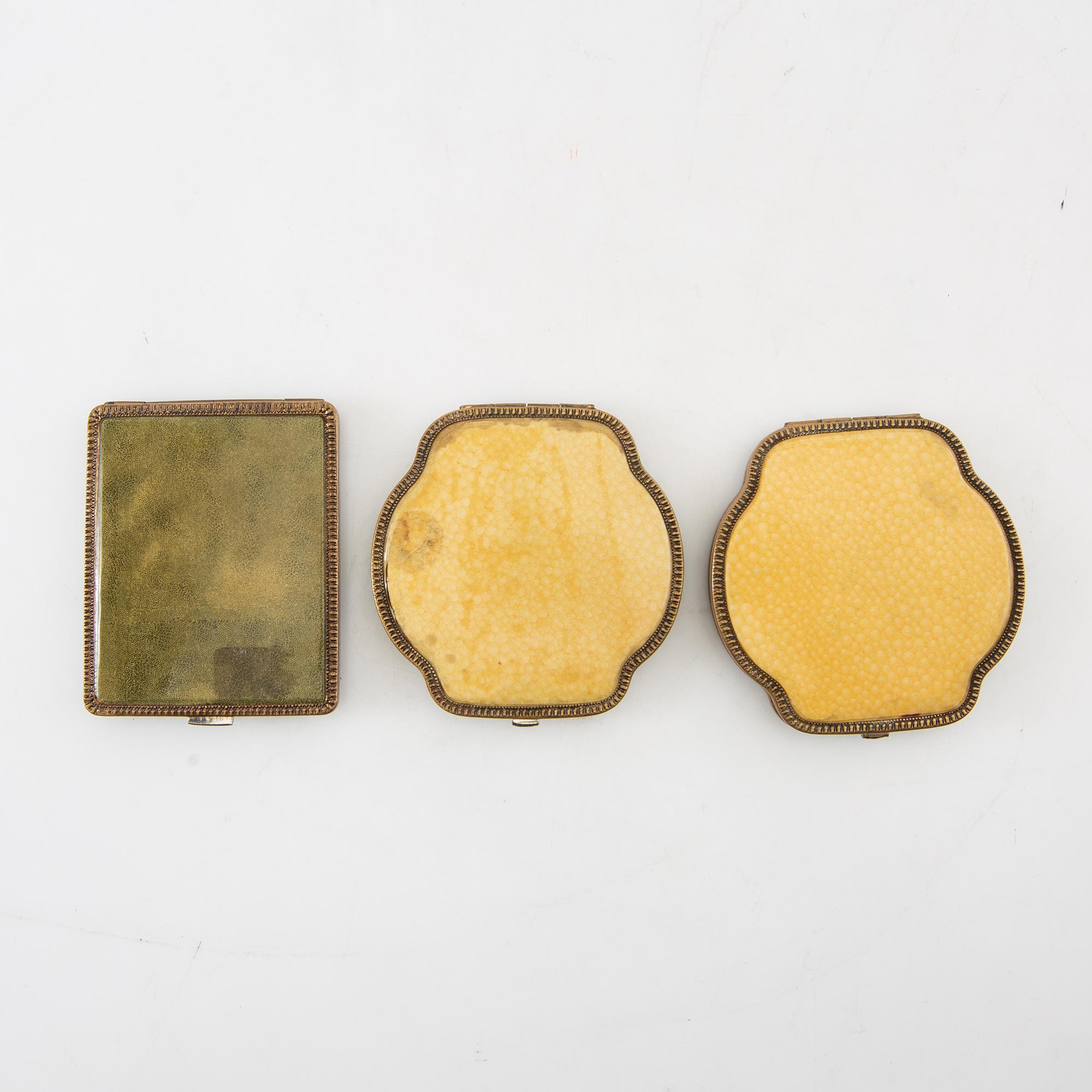 Powder boxes, a pair, and a cigarette case, early 20th century.
