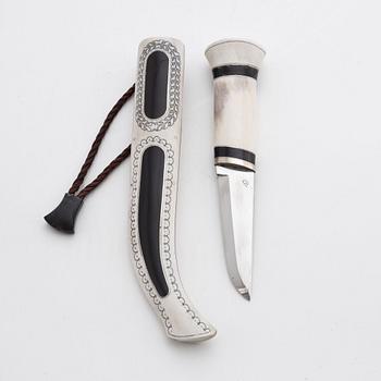 A reindeer horn knife with buffalo inlays by Bertil Fällman, signed.