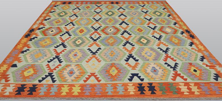 A Kilim carpet, approx. 298 x 258 cm.