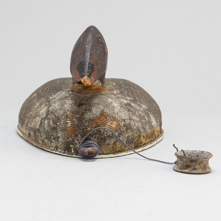 A early 20th century painted wood bird.