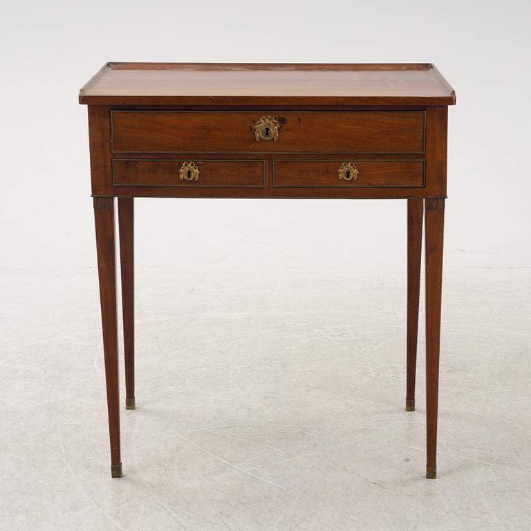 A late Gustavian mahogany writing table from araound the year 1800.