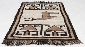 An oriental rug, c. 185 x 100 cm.