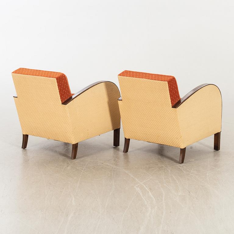 A pair of 1930/40:s Art Deco easy chairs.