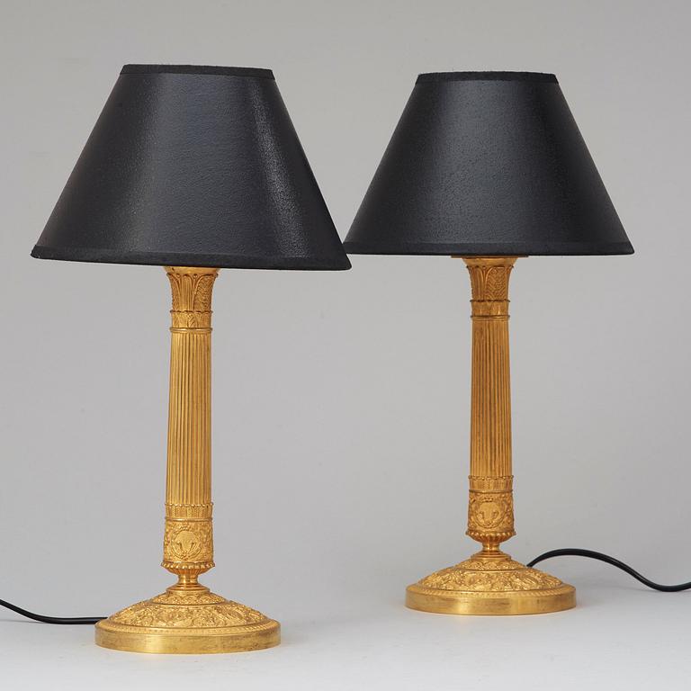 A pair of French Empire 19th century gilt bronze table lamps.