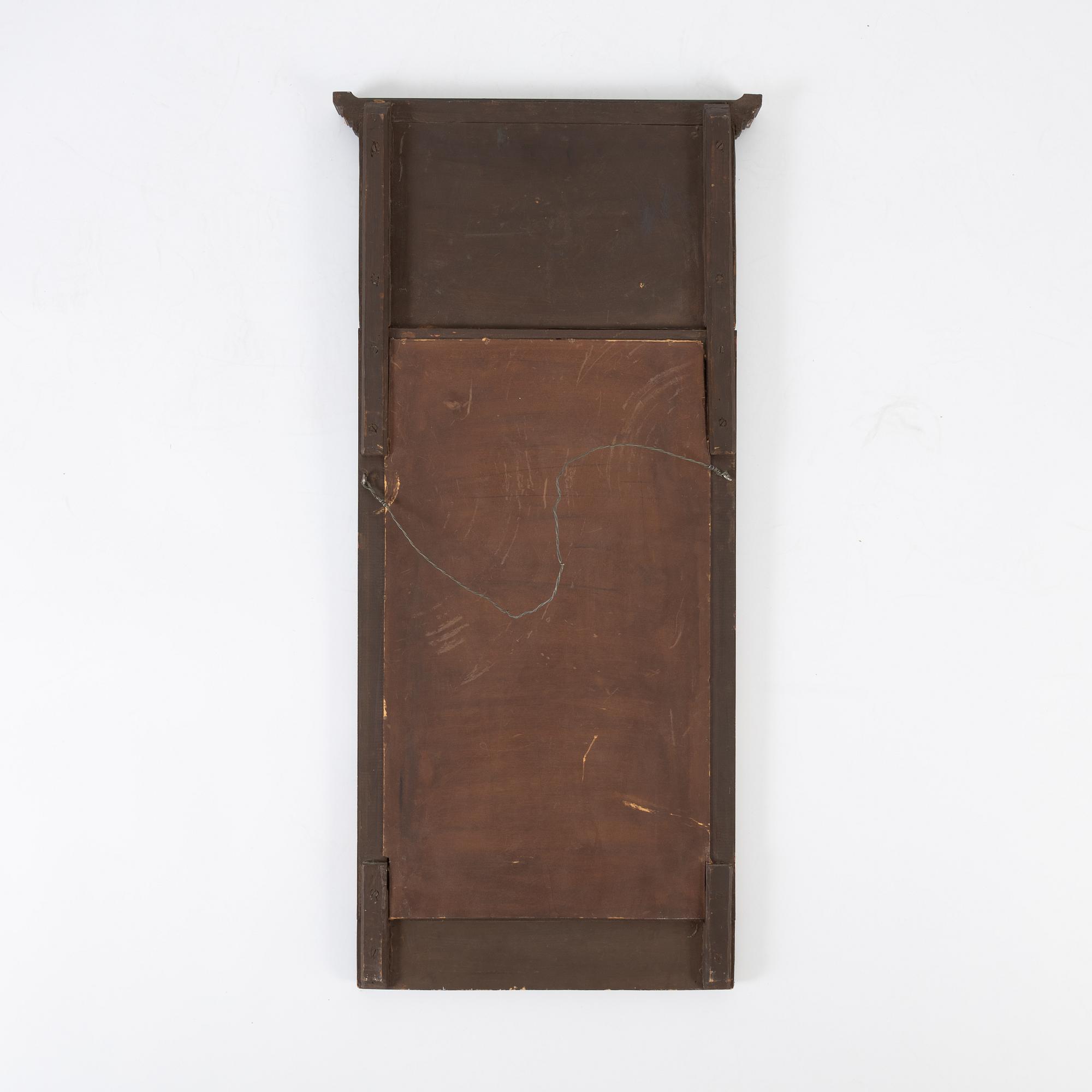 An Empire style mirror, first half of the 20th century.