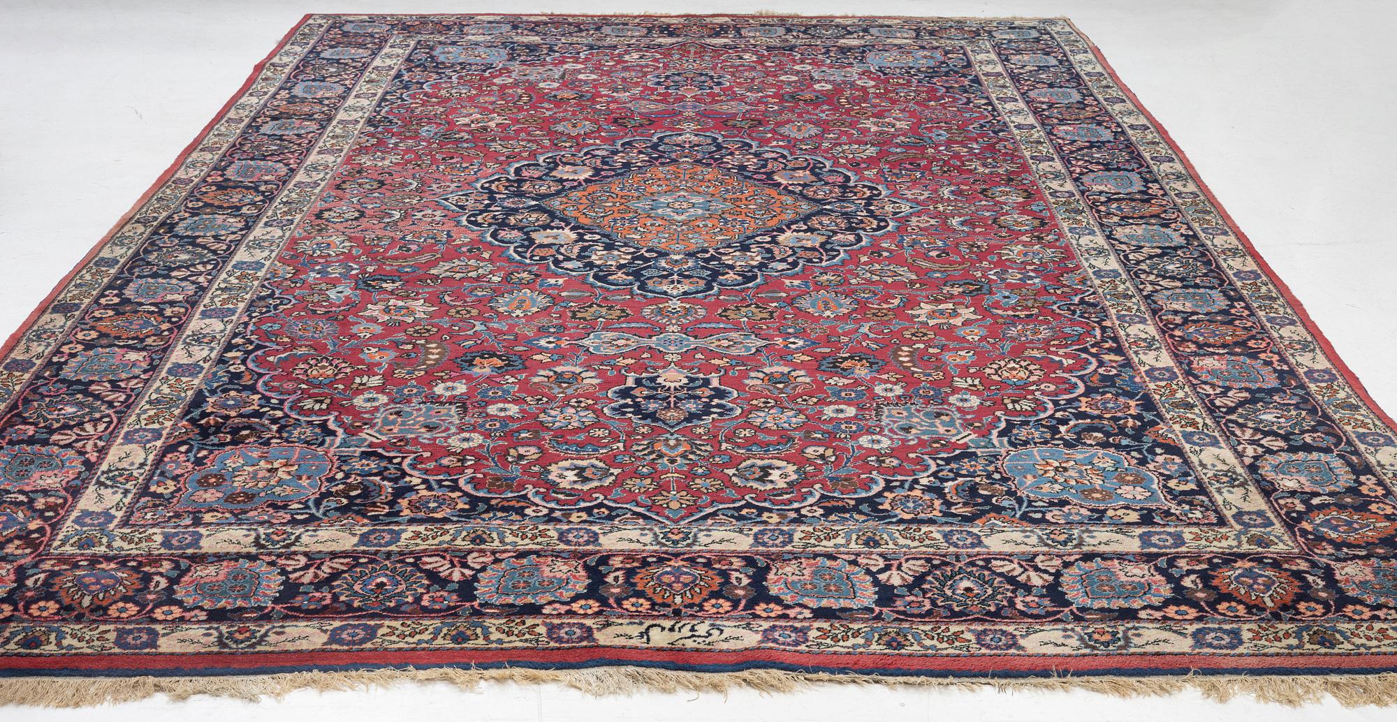 A semi-antique Mashad carpet, Eastern Iran, signed c. 507 x 303 cm.