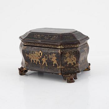 A Chinese lacquered tea caddy with pewter inserts, Qing dynasty, 19th century.