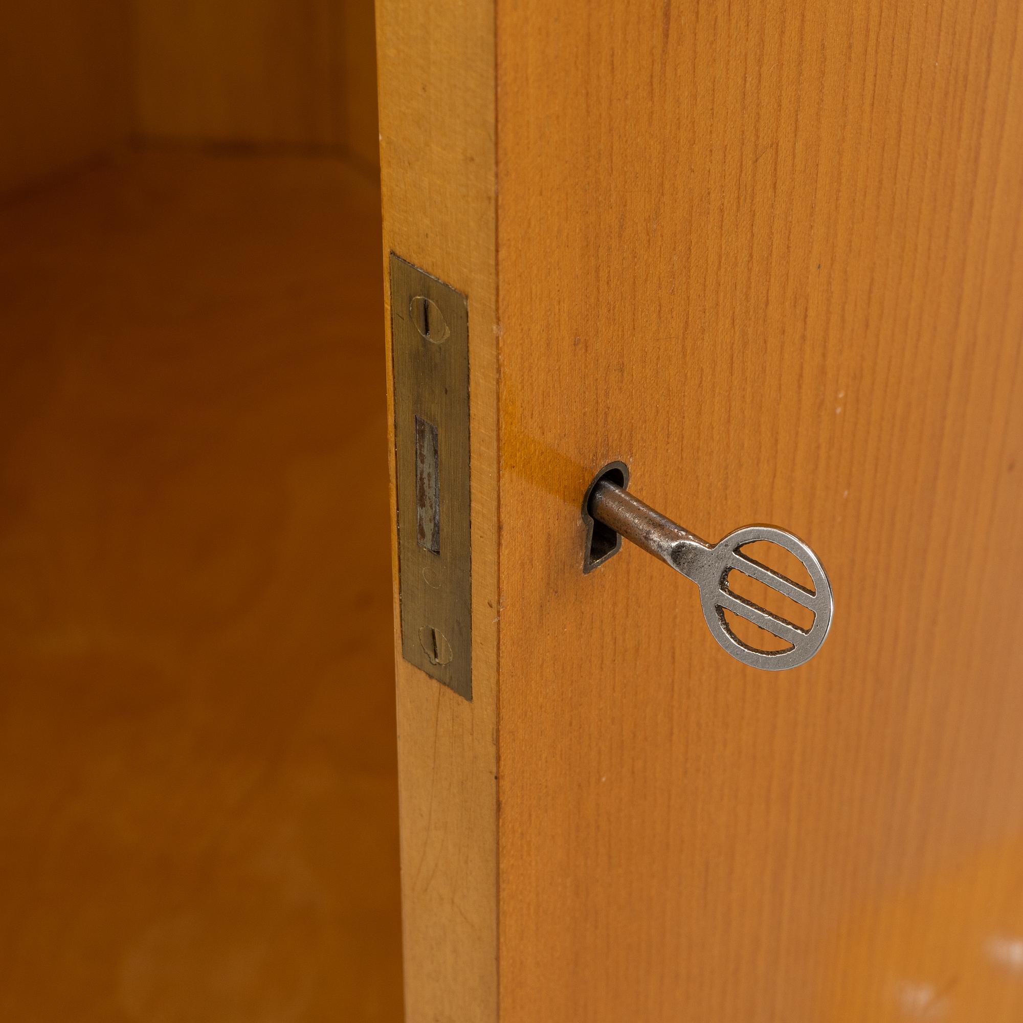 A Swedish Modern corner cabinet, 1940s.
