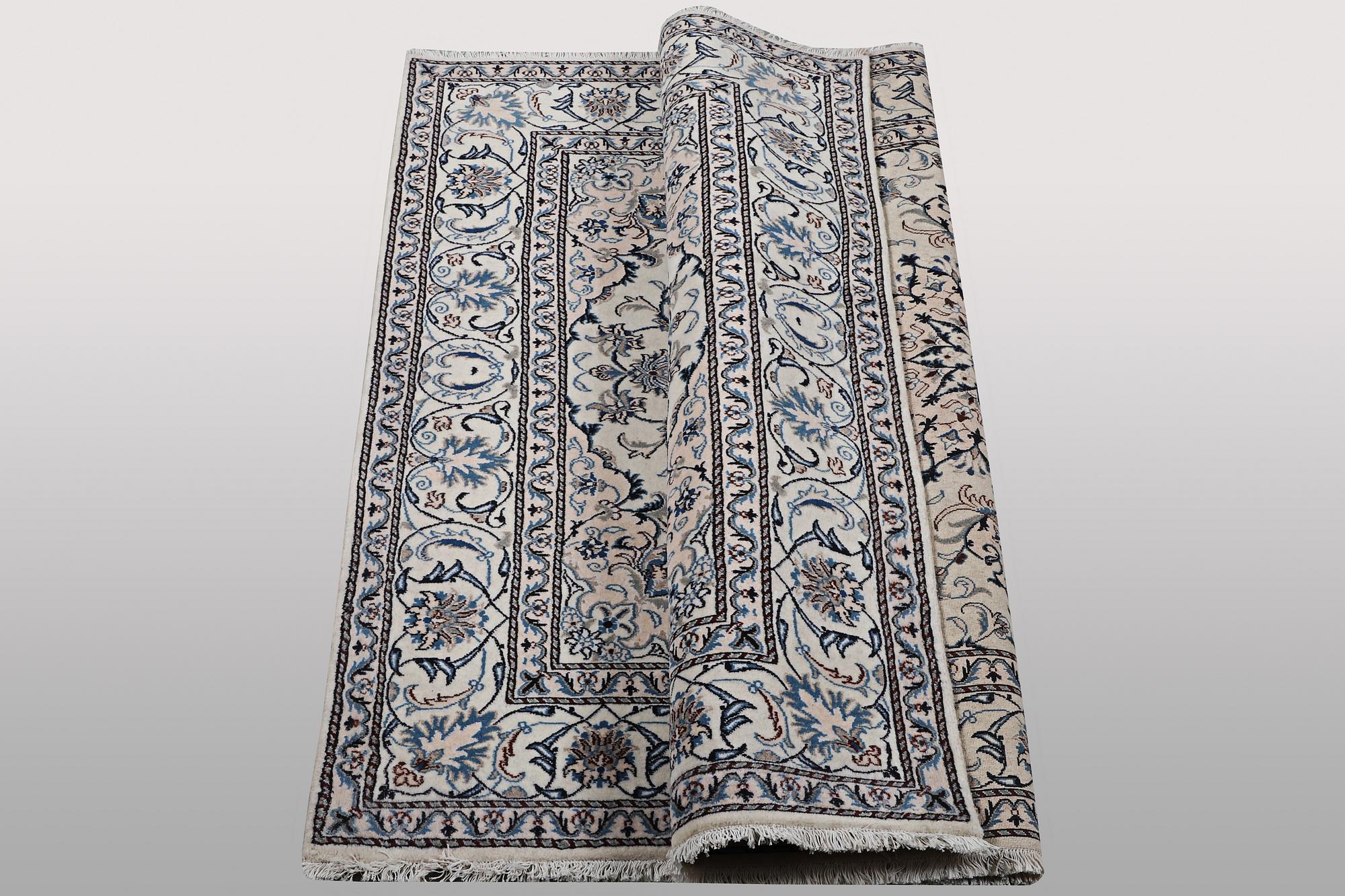 A rug, Nain, part silk, ca 200 x 195 cm.