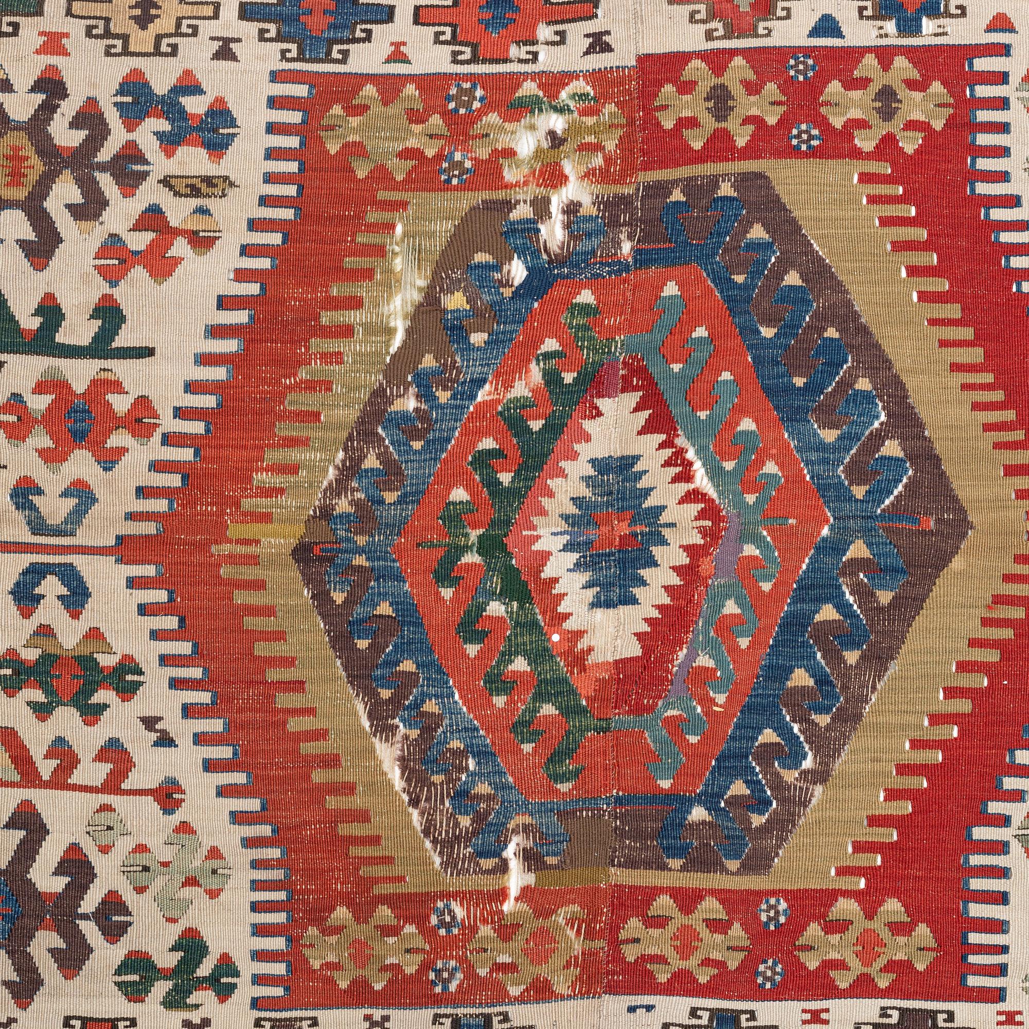 An antique Anatolian kilim, ca 324 x 169 cm.